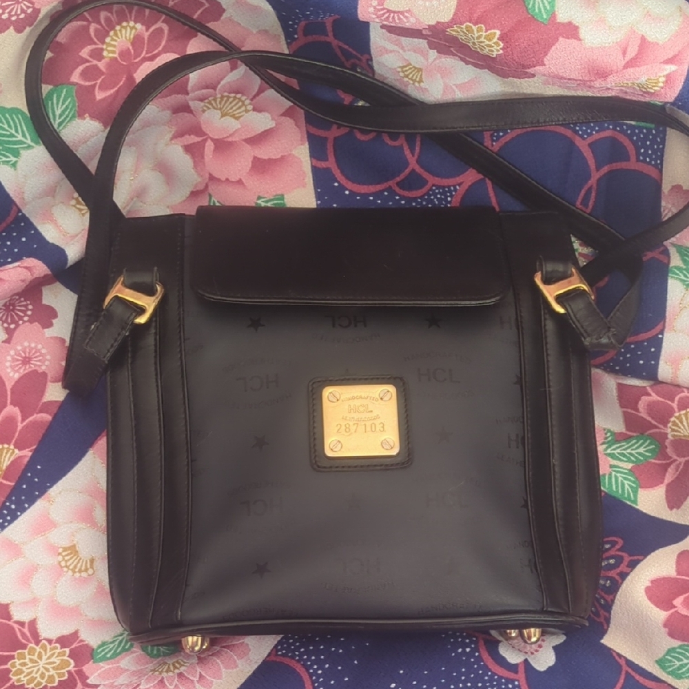 Elegant Black Crossbody Bag with Gold Details